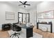 Bright office space featuring a fan, and a black table with decorations at 9820 N 87Th Pl, Scottsdale, AZ 85258