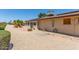 Backyard features rock landscaping, patio, and solar panels on the roof at 10236 N 105Th Dr, Sun City, AZ 85351