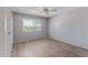 Bedroom featuring hardwood flooring, neutral paint and a window for natural lighting at 10236 N 105Th Dr, Sun City, AZ 85351