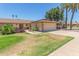 Inviting single-story home featuring solar panels, desert landscaping and an attached two-car garage at 10236 N 105Th Dr, Sun City, AZ 85351