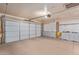 Two car garage with storage cabinets and an automatic door opener at 10236 N 105Th Dr, Sun City, AZ 85351