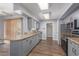 Eat-in kitchen with a large island and stainless-steel appliances at 10236 N 105Th Dr, Sun City, AZ 85351