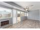 Bright sunroom with tile floor, and windows with white blinds bringing in plenty of natural light at 10236 N 105Th Dr, Sun City, AZ 85351