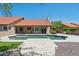 Beautiful backyard with a pool, patio, and well-maintained landscaping at 10450 E Terra Dr, Scottsdale, AZ 85258