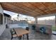 Covered outdoor patio with pool view, wood ceiling and bar height counter at 11007 N 26Th St, Phoenix, AZ 85028