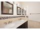 Stylish bathroom featuring a double sink vanity with marble countertop and mosaic tile accents at 11007 N 26Th St, Phoenix, AZ 85028
