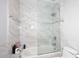 Bathroom featuring a shower and soaking tub, marble tile, and contemporary fixtures at 11007 N 26Th St, Phoenix, AZ 85028