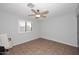 Bedroom featuring tile flooring, a ceiling fan, and neutral-colored walls at 11007 N 26Th St, Phoenix, AZ 85028
