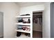 Well-organized closet with shelves for storage and rods for hanging clothes at 11007 N 26Th St, Phoenix, AZ 85028