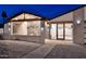 Inviting entrance features a cozy seating area, modern architectural details, and beautiful paving stones at 11007 N 26Th St, Phoenix, AZ 85028