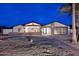 Beautiful modern home with desert landscaping, unique architectural details, and a sleek glass garage door at 11007 N 26Th St, Phoenix, AZ 85028