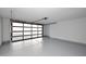 Spacious garage with epoxy flooring and modern glass paneled door at 11007 N 26Th St, Phoenix, AZ 85028
