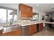 Kitchen with stainless steel appliances, wood cabinets, and a sleek countertop at 11007 N 26Th St, Phoenix, AZ 85028