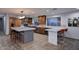 Spacious kitchen featuring custom cabinetry, stainless steel appliances, and a large marble island at 11007 N 26Th St, Phoenix, AZ 85028