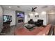 Inviting living room featuring a fireplace, flat screen TV, and comfortable seating at 11007 N 26Th St, Phoenix, AZ 85028