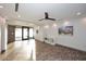 Bright living room featuring tile floors, fan and a view of the front yard at 11007 N 26Th St, Phoenix, AZ 85028