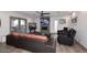 Inviting living room with a fireplace, two TVs, hardwood floors, and comfortable seating at 11007 N 26Th St, Phoenix, AZ 85028