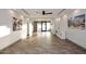 Spacious living room with wood-look tile flooring and recessed lighting at 11007 N 26Th St, Phoenix, AZ 85028
