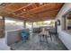 Outdoor kitchen on covered patio with stained wood ceiling and built in BBQ at 11007 N 26Th St, Phoenix, AZ 85028