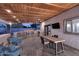 Inviting outdoor patio with wooden ceiling, built-in grill, and ample seating for entertaining guests at 11007 N 26Th St, Phoenix, AZ 85028