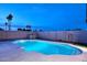 Inviting pool with tiled trim, concrete surround, and privacy fence, perfect for outdoor enjoyment and relaxation at 11007 N 26Th St, Phoenix, AZ 85028