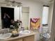 Bathroom featuring double sinks, shower, and natural lighting at 11411 N 91St Ave # 229, Peoria, AZ 85345