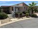 Inviting single-story home with a cozy front porch and well-manicured landscaping at 11411 N 91St Ave # 229, Peoria, AZ 85345