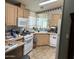 Functional kitchen with standard appliances and plenty of counter space at 11411 N 91St Ave # 229, Peoria, AZ 85345
