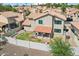 Backyard area featuring a well-kept lawn and a covered patio, enclosed by a pristine white fence at 1344 N Brittany Ln, Gilbert, AZ 85233