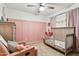 Bright, pastel-colored bedroom with a daybed and decorative decor at 1344 N Brittany Ln, Gilbert, AZ 85233