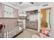 Bright, pastel-colored bedroom with a daybed, and decorative decor at 1344 N Brittany Ln, Gilbert, AZ 85233