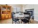 Elegant dining area with modern black chairs around a round white table at 1344 N Brittany Ln, Gilbert, AZ 85233