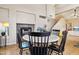 Dining area showing tile floors, fireplace, and access to other living spaces at 1344 N Brittany Ln, Gilbert, AZ 85233