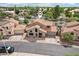 Charming two-story home featuring a well-maintained yard and a classic tile roof at 1344 N Brittany Ln, Gilbert, AZ 85233