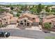 Charming two-story home featuring a well-maintained yard and a classic tile roof at 1344 N Brittany Ln, Gilbert, AZ 85233