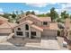 Charming two-story home featuring a well-maintained yard and a classic tile roof at 1344 N Brittany Ln, Gilbert, AZ 85233