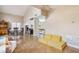 View of the living room with dining area featuring neutral colors and tile flooring at 1344 N Brittany Ln, Gilbert, AZ 85233