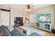 Cozy living room featuring a sleek fireplace and entertainment center at 1344 N Brittany Ln, Gilbert, AZ 85233