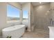 Elegant bathroom features a soaking tub, a separate glass shower, and a scenic view, creating a relaxing retreat at 14507 N Valencia Dr, Fountain Hills, AZ 85268