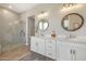Bright bathroom features dual sinks, a walk-in glass shower, and modern fixtures, offering a spa-like experience at 14507 N Valencia Dr, Fountain Hills, AZ 85268