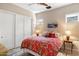 Cozy bedroom with a floral comforter, ensuite, closet, and natural light at 14507 N Valencia Dr, Fountain Hills, AZ 85268