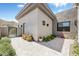 Private courtyard with decorative pavers, desert landscaping, and an iron gate at 14507 N Valencia Dr, Fountain Hills, AZ 85268