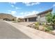 Contemporary home with a two-car garage, desert landscaping, and mountain views at 14507 N Valencia Dr, Fountain Hills, AZ 85268