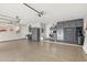 Spacious garage with epoxy floors, overhead lighting, and custom storage and work area at 14507 N Valencia Dr, Fountain Hills, AZ 85268