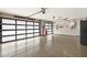 Modern garage with epoxy floors, overhead lighting, and stylish frosted glass garage doors at 14507 N Valencia Dr, Fountain Hills, AZ 85268
