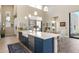 Spacious kitchen with a large island, stainless steel appliances, and modern pendant lighting at 14507 N Valencia Dr, Fountain Hills, AZ 85268