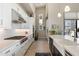 Bright kitchen featuring white cabinets, stainless steel appliances, and hardwood floors, offering modern style and functionality at 14507 N Valencia Dr, Fountain Hills, AZ 85268
