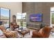 Bright living room with tall ceilings, large windows, and comfortable leather seating at 14507 N Valencia Dr, Fountain Hills, AZ 85268