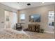 Bedroom includes a view to the outside, a flatscreen, and an adjoining primary bathroom at 14507 N Valencia Dr, Fountain Hills, AZ 85268