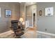 Comfortable home office with a reading chair, lamp, and tasteful decor at 14507 N Valencia Dr, Fountain Hills, AZ 85268